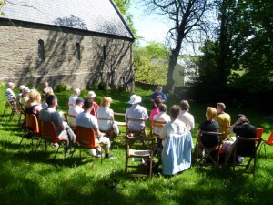 Worshiping God in the sunshine at Dhoon before the start of the walk around Maughold 2012