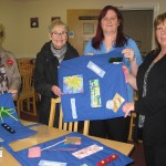 Gladys and Elsie presenting Fiddle Pinnies to Thomas Knight Care Centre in Blyth